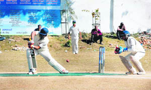 A batsman in action in the 4th Girish Bhadri Memorial Cricket Tournament played at Rangers College ground in Dehradun on Monday. 