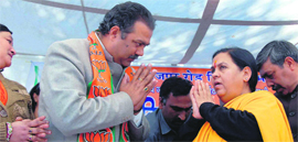 Uma Bharati with a BJP candidate at an election rally in Dehradun on Monday.