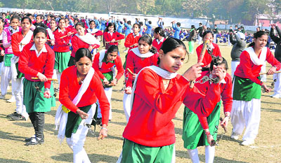 Students take part in a rehearsal for the Republic Day function at Karna Stadium