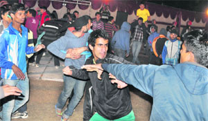 Athletes exchange blows during a campfire function in Ludhiana on Sunday night. 