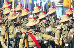 Soldiers take part in the rehearsal for the Republic Day parade in Shimla