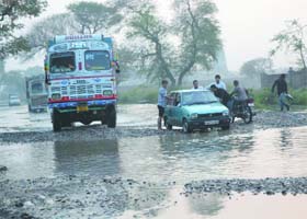 A file picture of sewage water accumulated on National Highway-703 in Shahkot