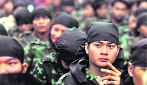 Militants at the surrender venue in Guwahati on Tuesday. 
