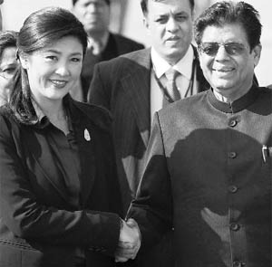 Thailands first woman Prime Minister Yingluck Shinawatra (L) with E Ahmed, Minister of State for External Affairs, upon her arrival in New Delhi on Tuesday.