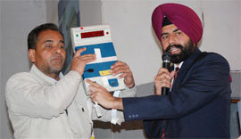 (Above) The polling staff during the final rehearsal and (left) polling officers demonstrating the working of an EVM at Govt Polytechnic College in Bathinda on Wednesday.