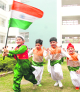 Children in a joyous mood before performing for the Republic Day function at their school in Mohali