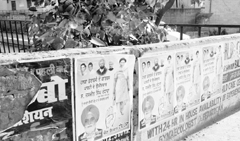 Political posters pasted on the boundary wall of a nullah at Dhakoli village in Zirakpur 