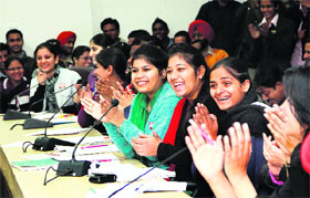 First-time voters interact with District Electoral Officer Priyank Bharti's at Kanya Maha Vidyalaya in Jalandhar on Wednesday.