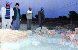 Debris of the houses dismantled along the Bathinda-Mansa road.