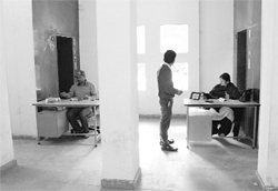 A doctor and her assistant work at a temporary place at the e-disha building in Panchkula.