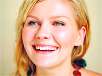 GETTING COZY: Kirsten Dunst 