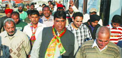 Rakesh Gill, BJP candidate from the Amritsar West constituency during a door-to-door campaign in Amritsar.