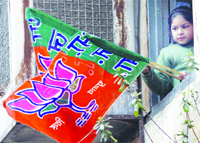 A child waves a BJP flag in Amritsar