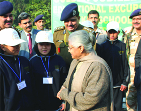 Delhi Chief Minister Sheila Dikshit meets students from earthquake-affected areas of Sikkim at her residence in New Delhi on Saturday. 