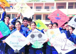 Students display social messages on kites at a school in Karnal on the occasion of Basant Panchami on Saturday.