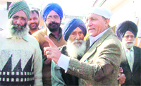SAD candidate SR Kaler being greeted by an elderly person at Jagraon. 