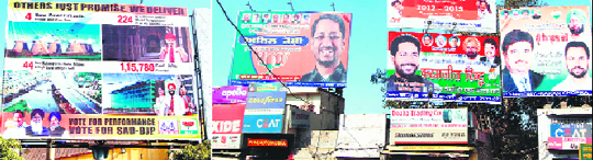 Violating poll code, scores of hoardings belonging to various political parties have still not been removed, despite the EC's directions, in Amritsar. 