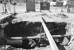 The caved in portion of the sewerage line at the Kumbhra traffic light point in Sector 70