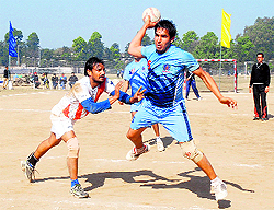 Players in action during a handball match at Panjab University on Sunday