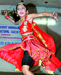 A girl performs a dance at a cultural event in Dehradun on Sunday