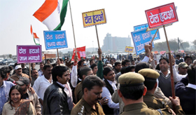 Members of the Toll Hatao Sangharsh Samiti stage a demonstration against two toll plazas in Gurgaon on Sunday.
