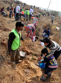 Children plant saplings during a plantation drive at Bio-Diversity, Gurgaon, on Sunday.
