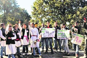 HPU students hold a protest against the fee hike proposal on the campus in Shimla on Sunday