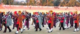 A contingent plays a band during the Beating Retreat at MA Stadium in Jammu on Sunday
