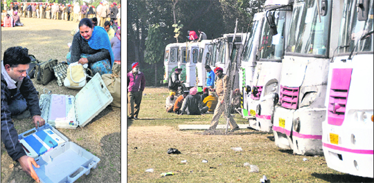 An employee checks an EVM in Ludhiana on Sunday. tribune photo: himanshu mahajan; Buses of the PRTC parked at the Khalsa College for Women. These will ferry election officials and poll material.