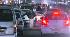 A man tries to pass through chaotic traffic at Ghumar Mandi in Ludhiana on Sunday.