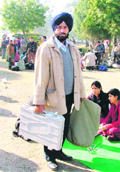 Kuldeep Singh carries election material in Ludhiana on Sunday.
