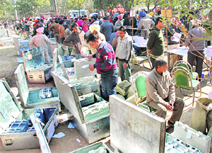 Officials collect electronic voting machines at Government College in Dera Bassi on Sunday.