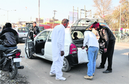 Security personnel check vehicles entering Punjab at Killianwali village on the Punjab-Haryana border on Sunday.