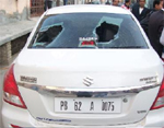 The smashed rear windscreen of the car of Block Youth Congress vice-president Ranjam Kamra