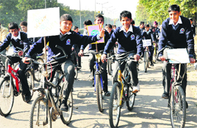 Students take part in a bicycle rally in Sector 17, Chandigarh, on Monday.