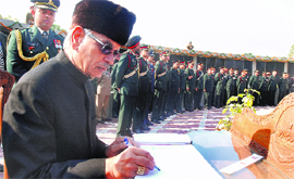 Governor of Punjab and UT Administrator Shivraj V Patil writes his views in the comment book after laying a wreath at the War Memorial in Chandigarh on Monday.