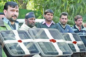 The accused along with the spurious gold bars, coins and ornaments seized from them in New Delhi on Monday