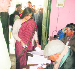 Nidhi Mani Tripathi, District Electoral Officer, Nainital, casts her vote on Monday. 