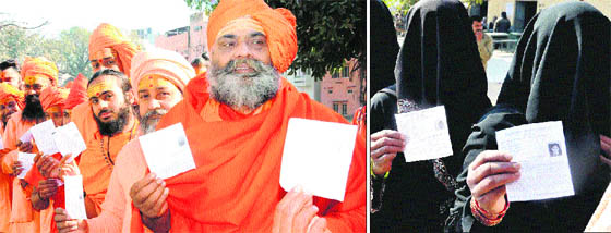 Saints wait to cast their votes at Bhoopatwala in Haridwar on Monday; and (right) Muslim women show their voter cards. 