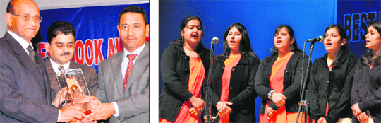 Minister for Tourism and Culture Nwang Rigzin Zora presents an award to a writer; and (right) girls present a song during the Best Book Award presentation ceremony at the Police Auditorium in Jammu on Monday. 