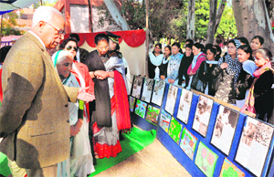 Governor NN Vohra at a photo exhibition organised on the Mahatma Gandhis 64th death anniversary at the Government Women College in Jammu on Monday. First Lady Usha Vohra is also seen in the picture.