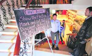 A board outside a restaurant announcing discount for those who have exercised their right to franchise in Ludhiana on Monday. 