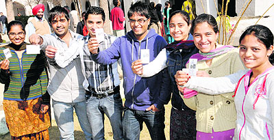 Young voters with their I cards in Mahilpur village of Hoshiarpur. 