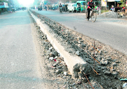 The divider between the road near Guru Nanak Dev Hospital on Majitha Road, which was demolished shortly after construction, in Amritsar on Tuesday. 