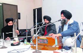 Alankar Singh, an assistant professer of Gurmat sangeet at Punjabi University, Patiala, performs at MKP Girls College during a SPIC MACAY programme in Dehradun on Tuesday