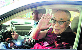 The Dalai Lama comes out of the Kangra airport on Tuesday after returning from Delhi where he underwent a successful cataract surgery on his left eye.