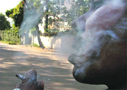 A man smokes at a public place in Ludhiana.