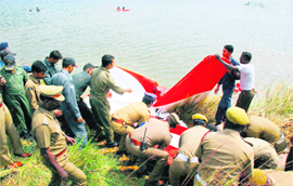 Rescue work in progress after an IAF trainer aircraft plunged into the Ayyanchery Lake, near Chennai, on Tuesday. The two-seater Kiran aircraft was returning to the Tambaram station after a routine sortie.