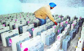 A cop stands guard outside a room with EVMs in Patiala