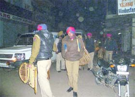 Policemen patrolling a road in Malerkotla on Tuesday